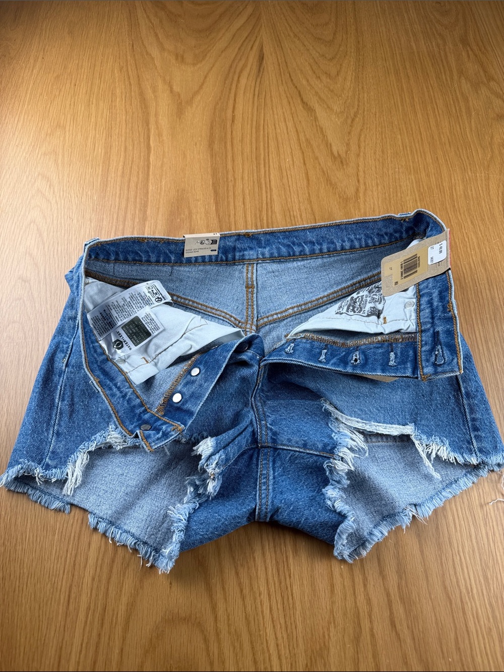 Levi's Women's 501 Light Blue Distressed Denim Cutoff Shorts 563270251 - Picture 3 of 5